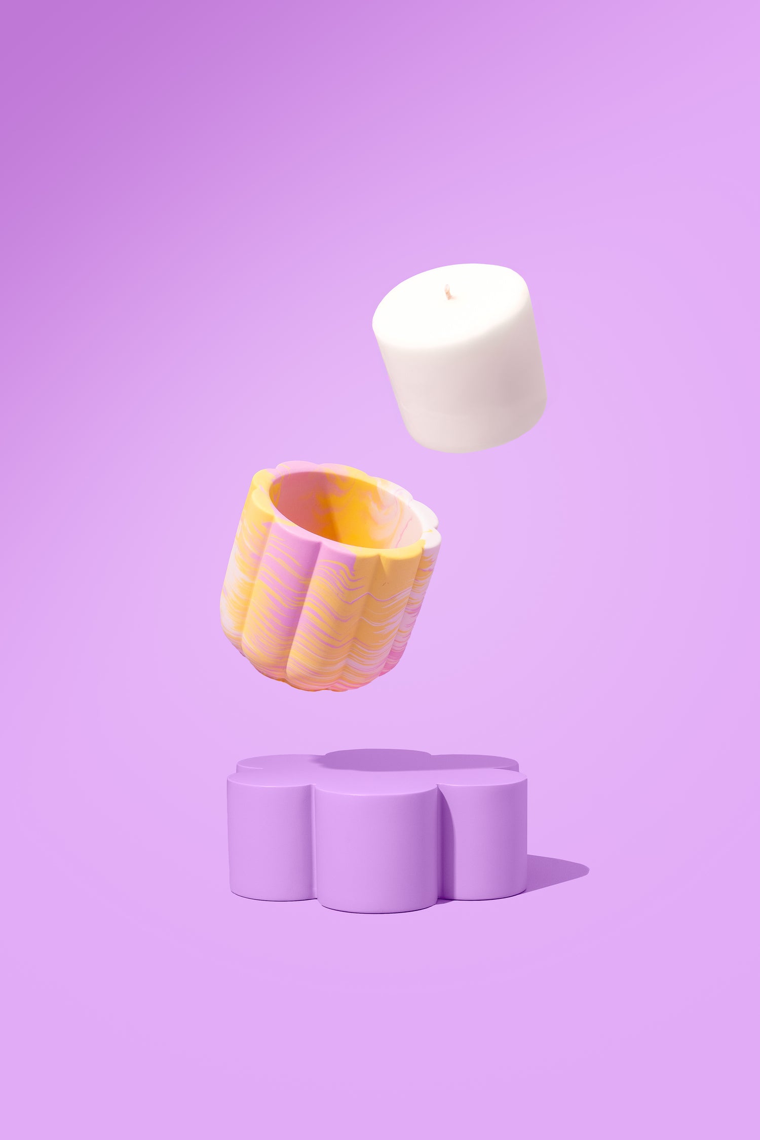 Colorful candle on a purple background